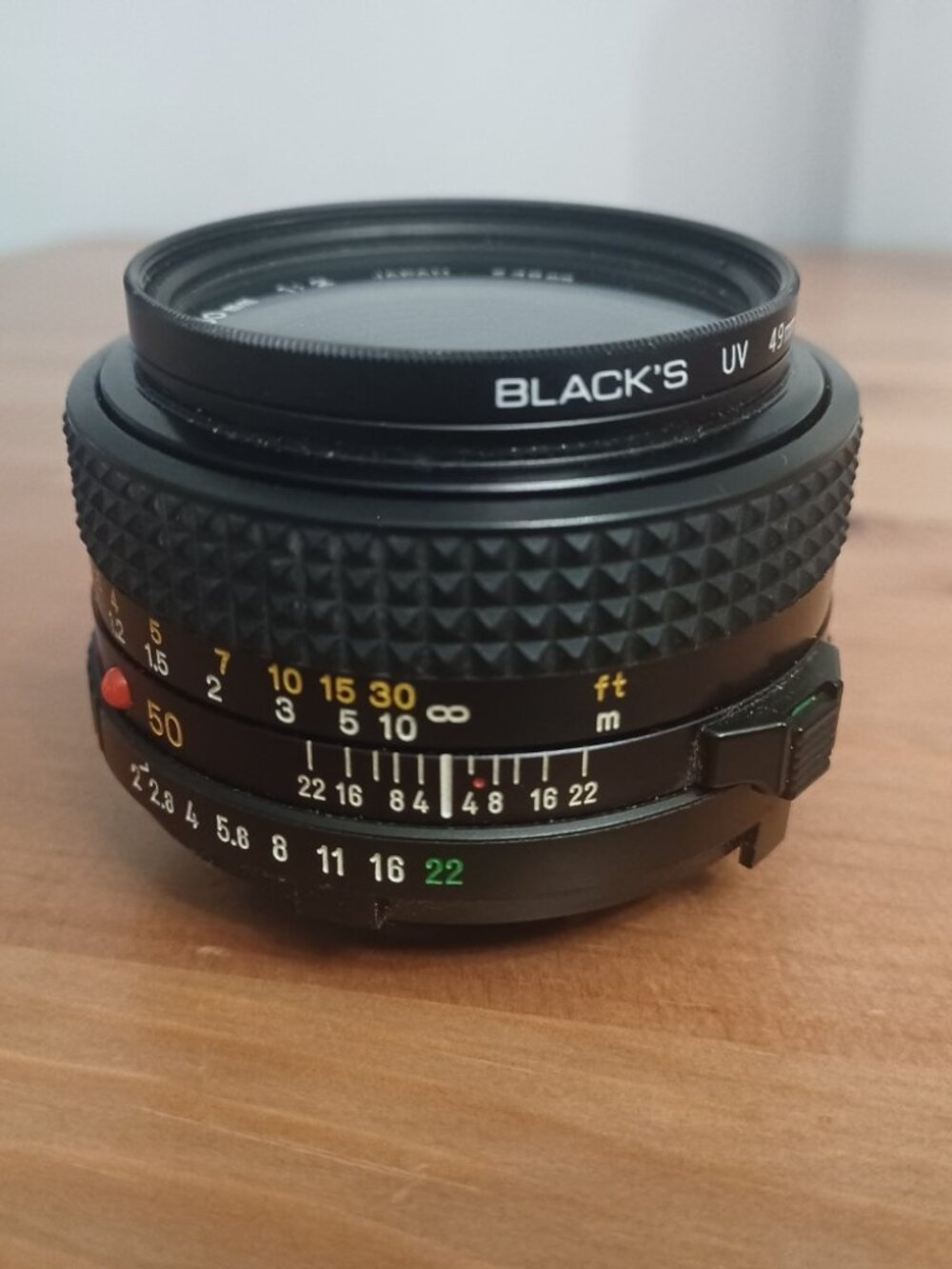 Minolta MD 50mm f/2 Manual Focus Prime Lens w/ Black's 49mm UV Filter - Clean